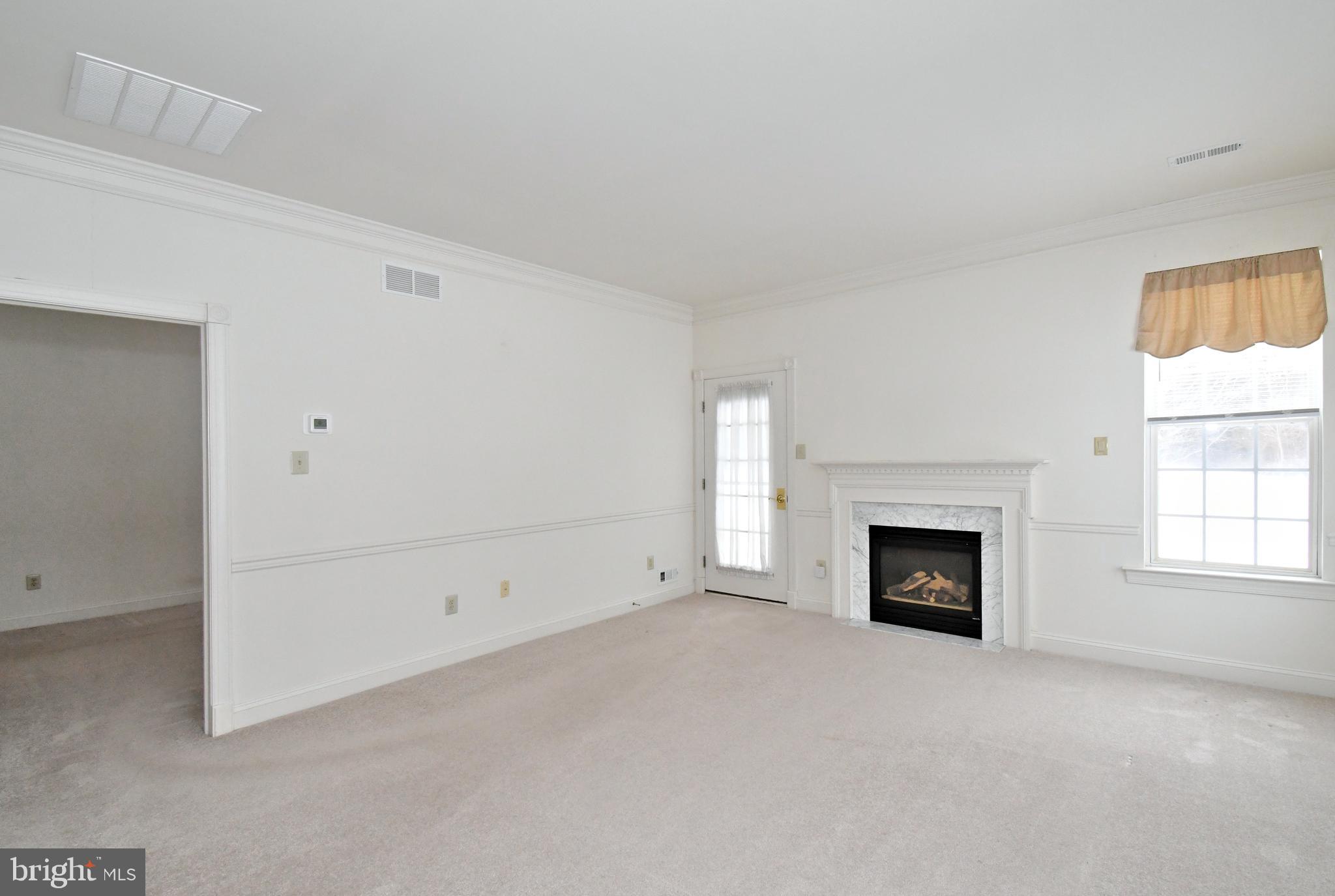 425 Ruth Court Harleysville, PA 19438 - Photo 7 of 26 a view of empty room with a fireplace