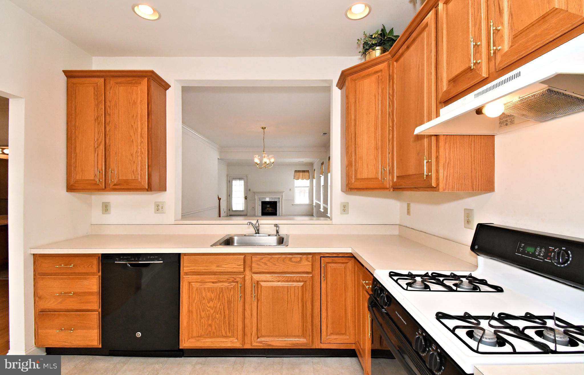 425 Ruth Court Harleysville, PA 19438 - Photo 9 of 26 a kitchen with stainless steel appliances granite countertop a stove and a sink