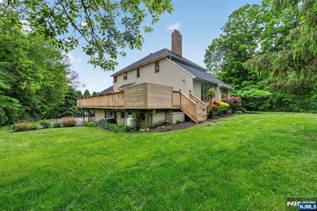 5110 Berkshire Valley Road Oak Ridge, NJ 07438 - Photo 44 of 49 a front view of a house with garden
