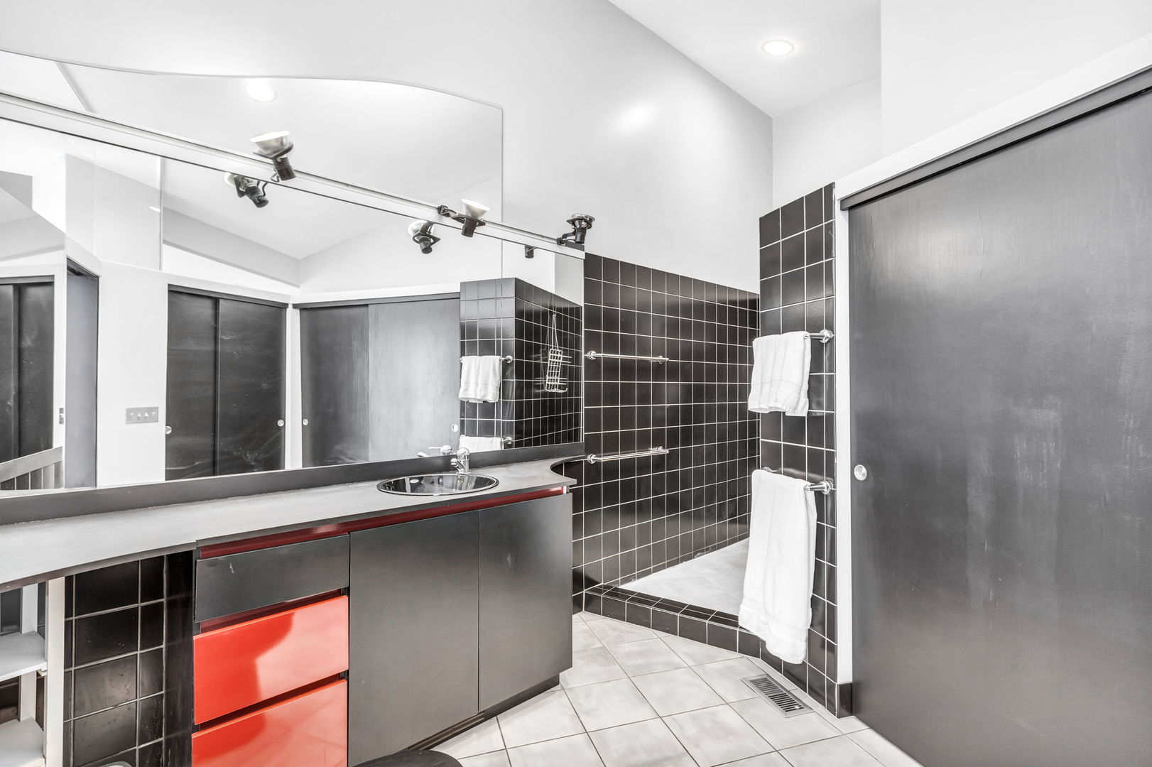 1610 Dempster Street Evanston, IL 60202 - Photo 15 of 28 a bathroom with a sink and a mirror