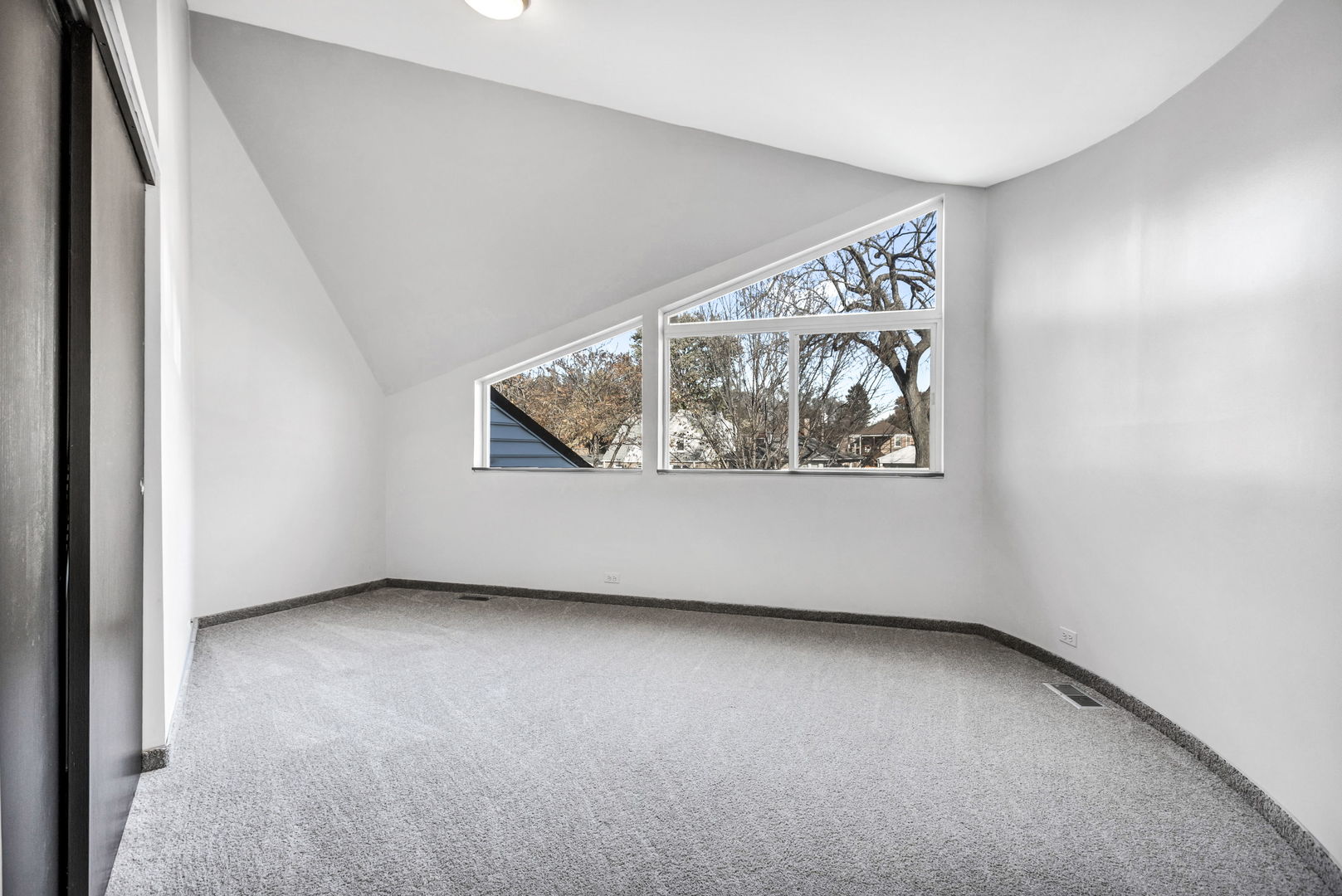 1610 Dempster Street Evanston, IL 60202 - Photo 17 of 28 an empty room with windows