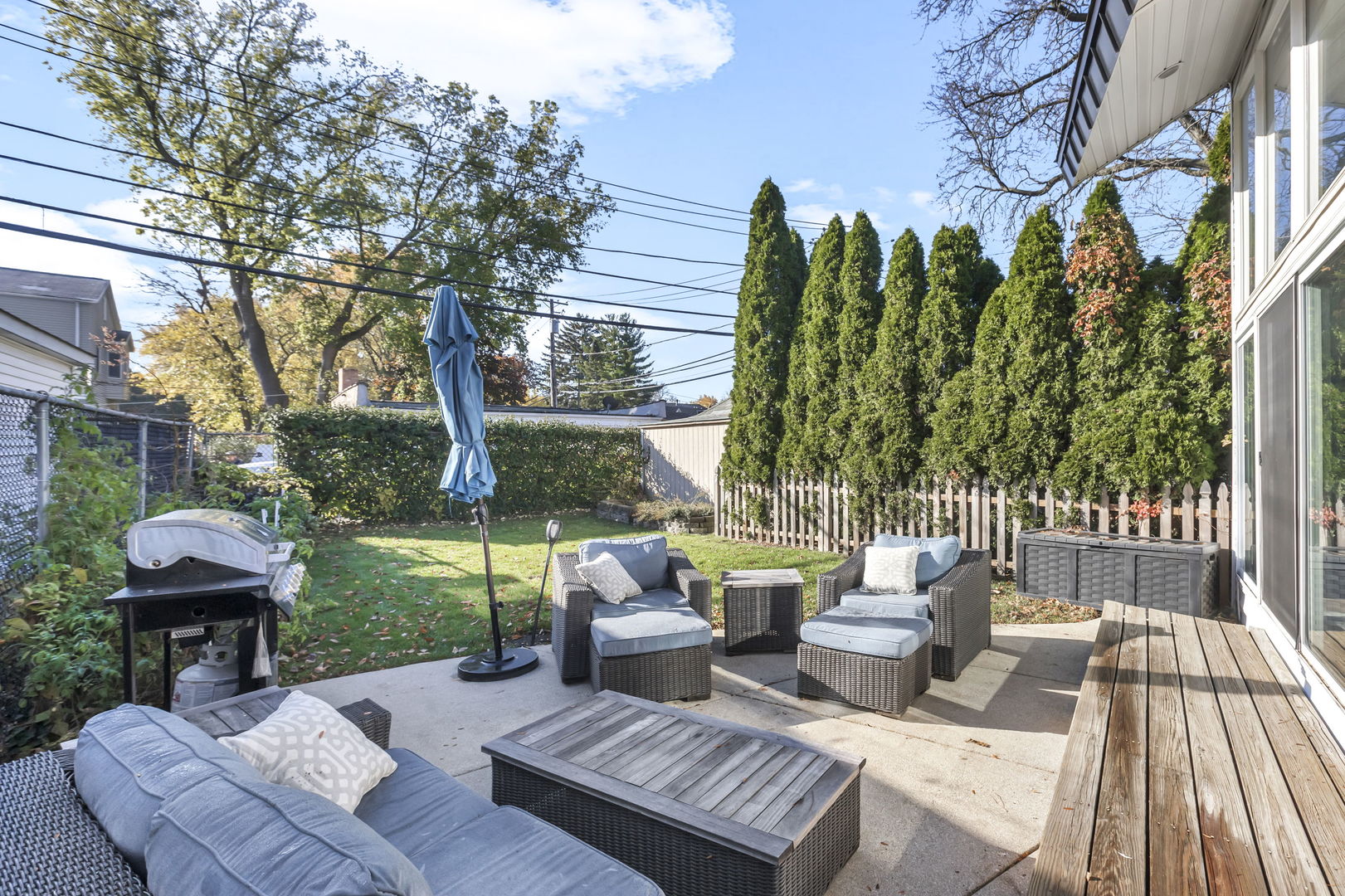 1610 Dempster Street Evanston, IL 60202 - Photo 23 of 28 a view of a patio with couches table and chairs and potted plants