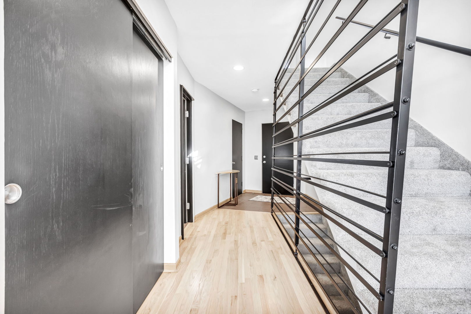 1610 Dempster Street Evanston, IL 60202 - Photo 3 of 28 a view of a hallway with wooden floor and staircase
