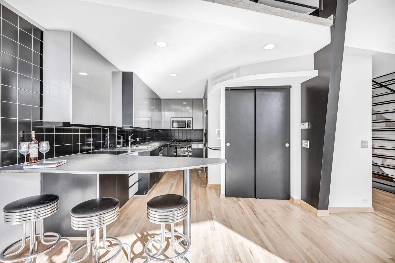 1610 Dempster Street Evanston, IL 60202 - Photo 9 of 28 a large kitchen with a table and chairs