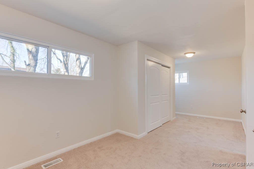 3310 West Weaver Road Hampton, VA 23666 - Photo 16 of 28 an empty room with windows