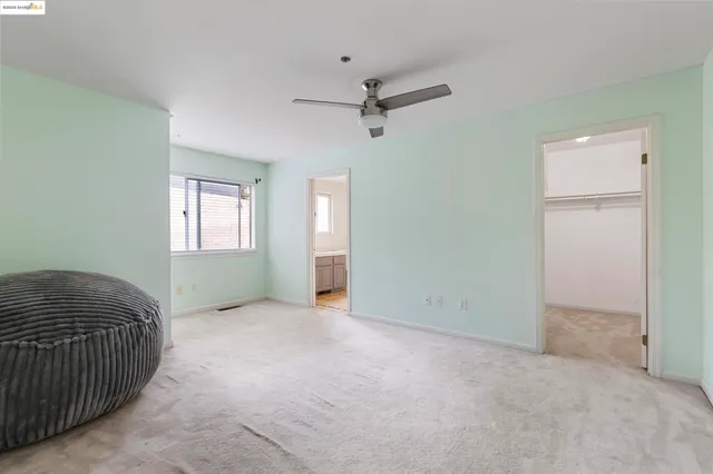 a bathroom with a granite countertop sink toilet and a mirror