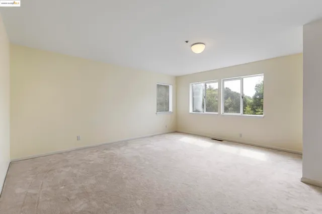 a bathroom with a sink mirror and toilet