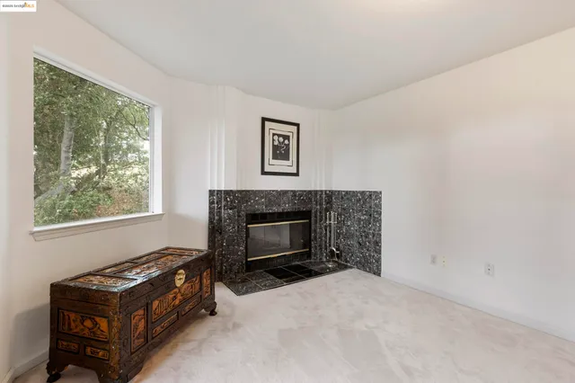 a kitchen with stainless steel appliances granite countertop a stove and a refrigerator