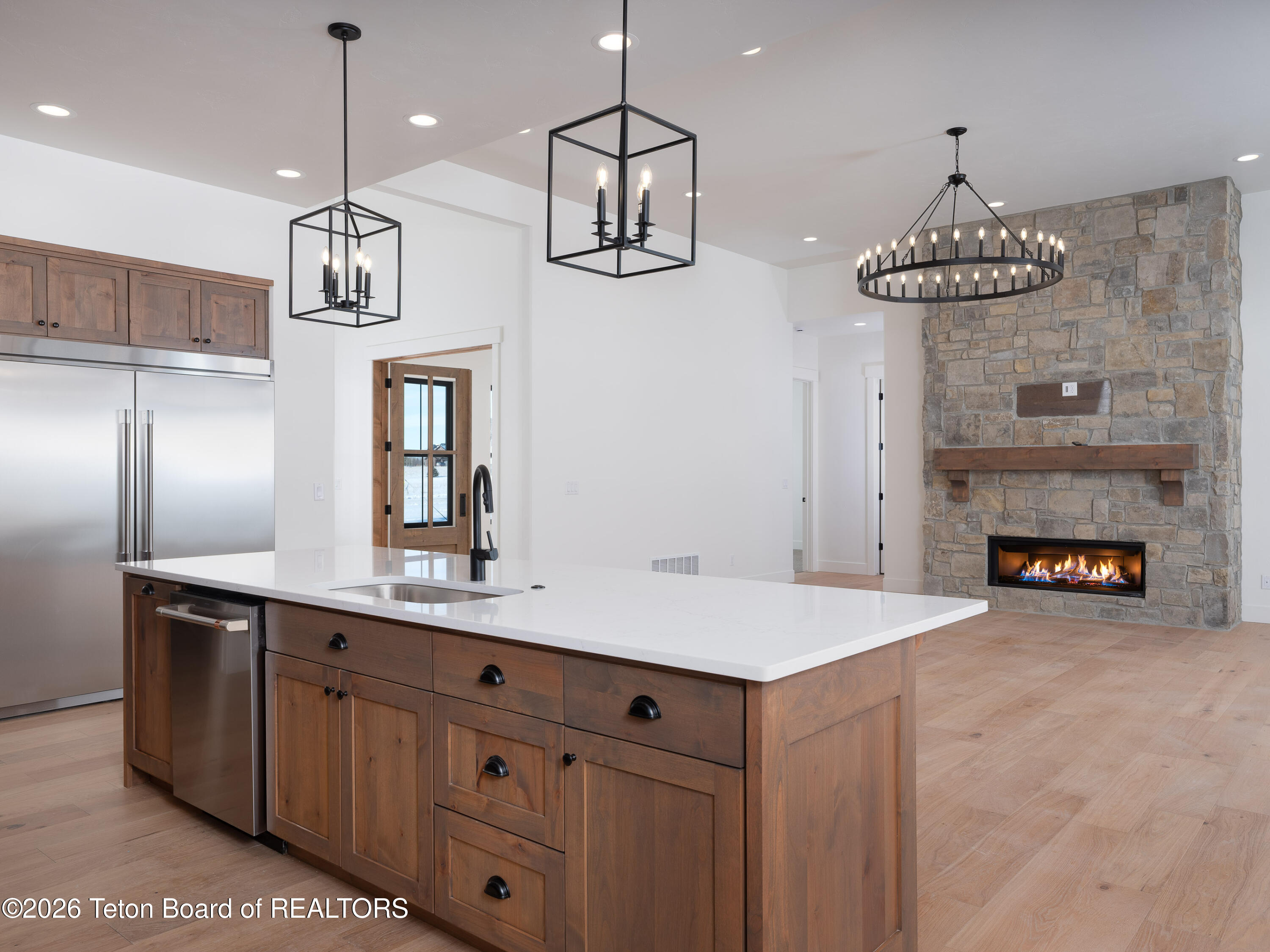 706 Royal Elk Circle Victor, ID 83455 - Photo 3 of 29 03 kitchen living entry
