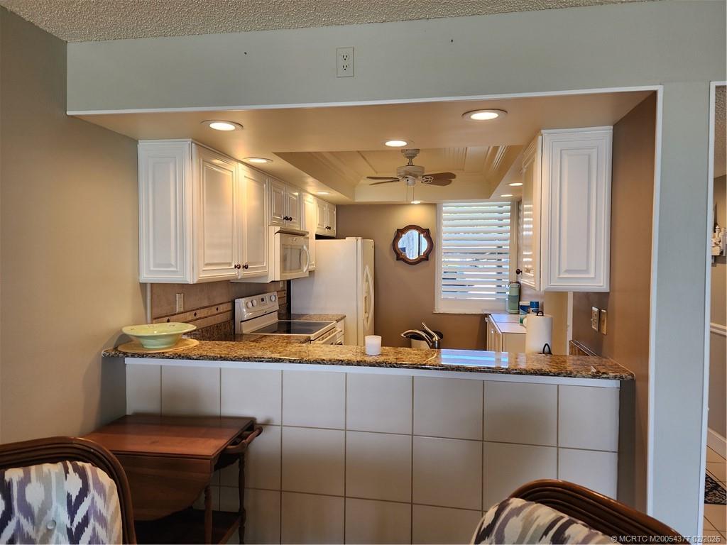 1950 Southwest Palm City Road, Unit 13102 Stuart, FL 34994 - Photo 13 of 40 a bathroom with a sink and a mirror