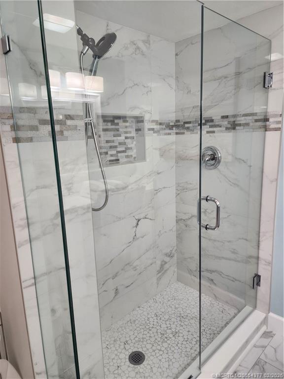 1950 Southwest Palm City Road, Unit 13102 Stuart, FL 34994 - Photo 23 of 40 a bathroom with a shower