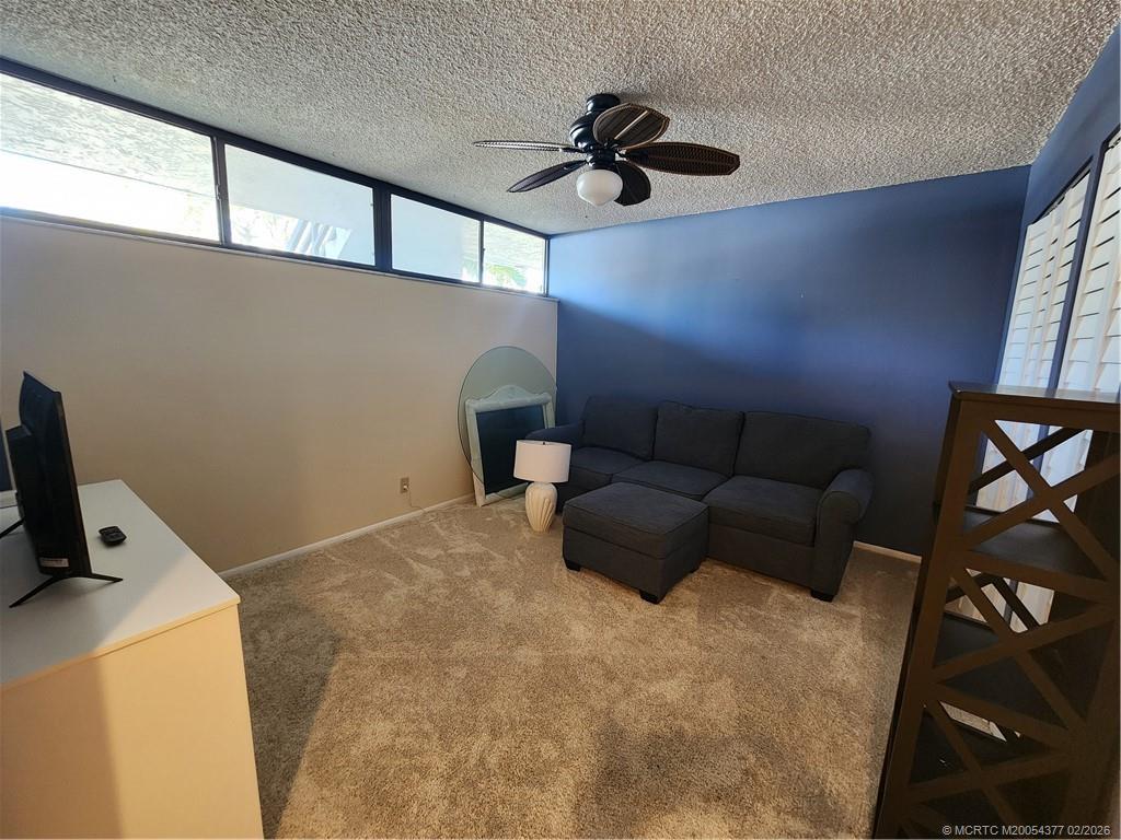 1950 Southwest Palm City Road, Unit 13102 Stuart, FL 34994 - Photo 24 of 40 a living room with furniture