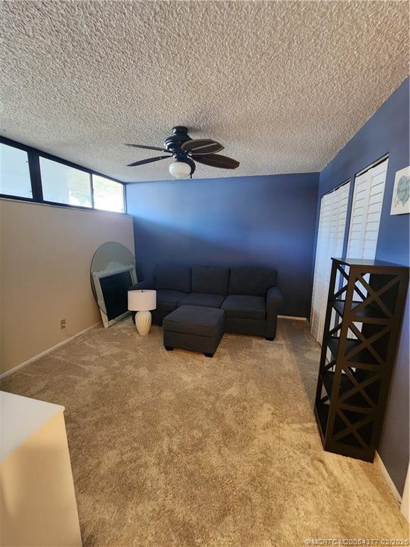 1950 Southwest Palm City Road, Unit 13102 Stuart, FL 34994 - Photo 26 of 40 a bed room with a bed and a chair