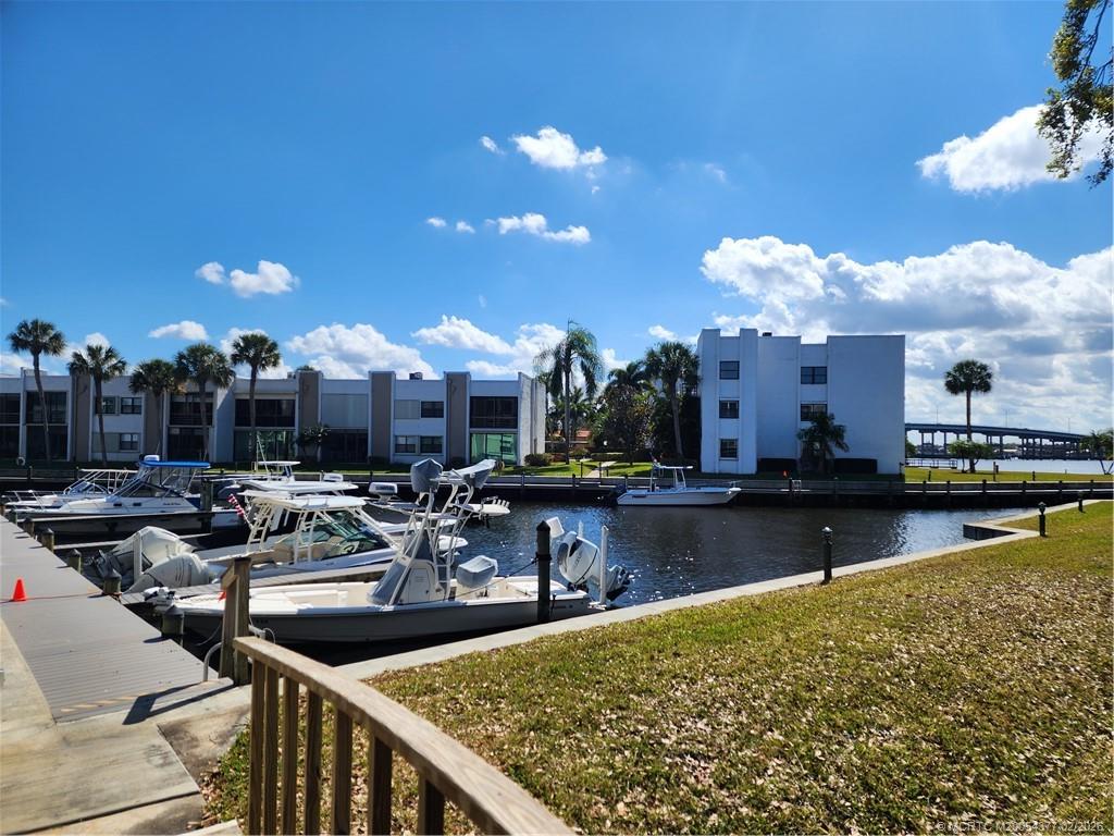1950 Southwest Palm City Road, Unit 13102 Stuart, FL 34994 - Photo 32 of 40 a view of a swimming pool with outdoor seating