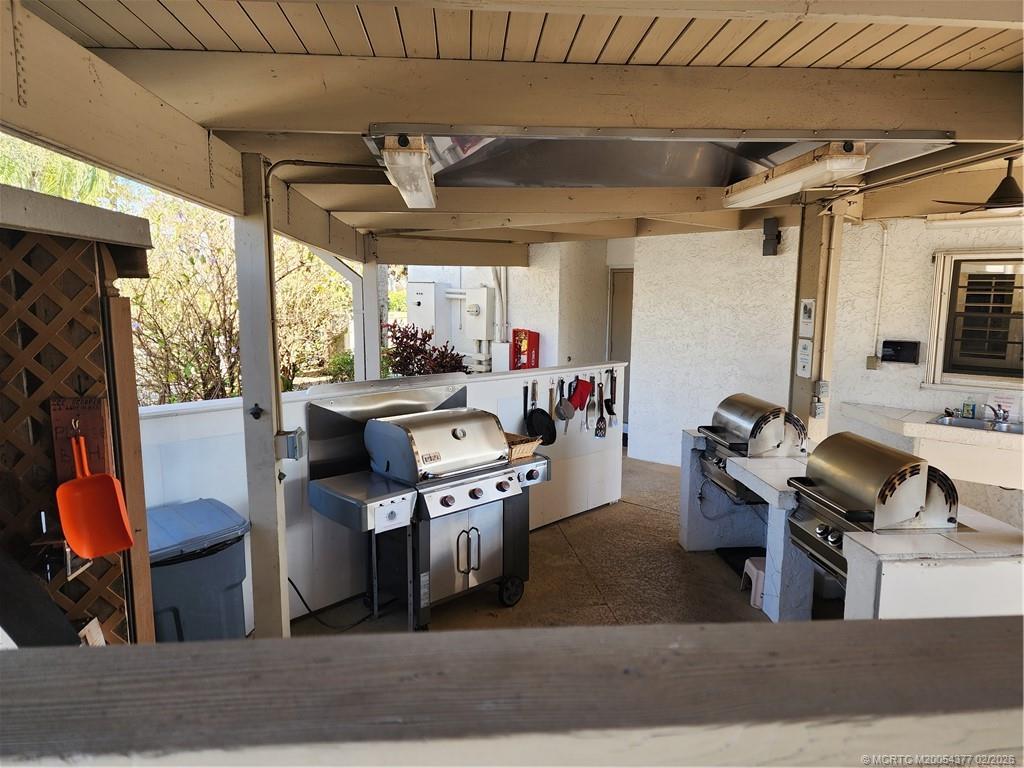 1950 Southwest Palm City Road, Unit 13102 Stuart, FL 34994 - Photo 33 of 40 a view of a kitchen with kitchen island granite countertop lots of counter top space