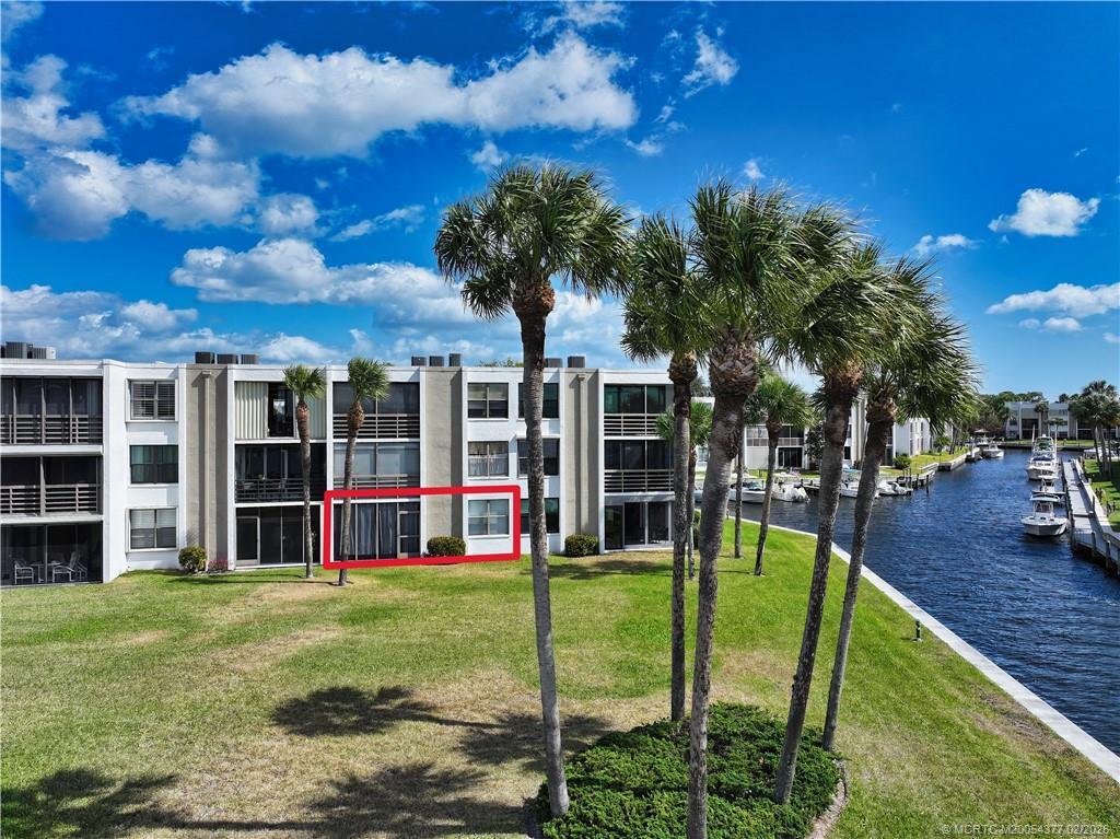 1950 Southwest Palm City Road, Unit 13102 Stuart, FL 34994 - Photo 36 of 40 a view of a house with backyard and porch