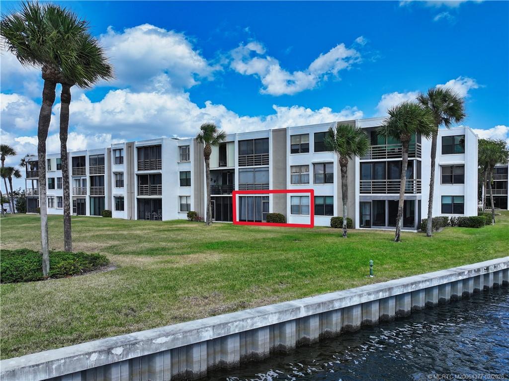 1950 Southwest Palm City Road, Unit 13102 Stuart, FL 34994 - Photo 37 of 40 a view of a house with a garden and yard
