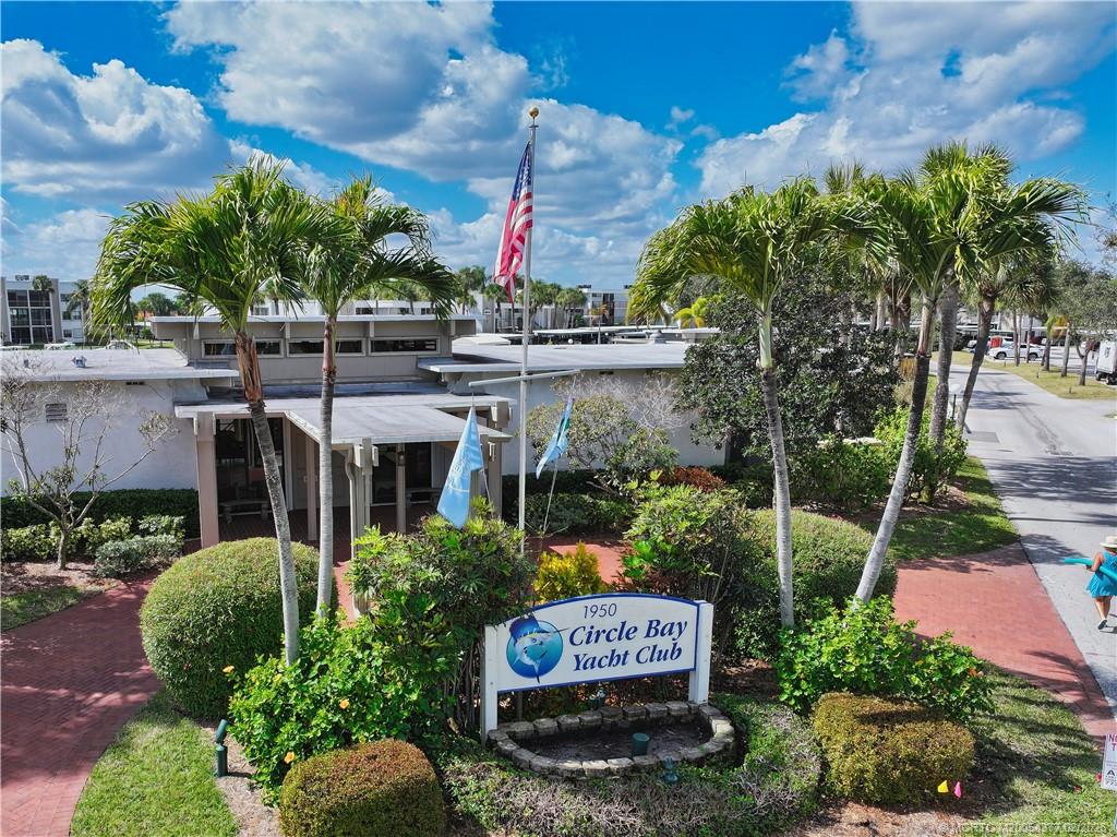 1950 Southwest Palm City Road, Unit 13102 Stuart, FL 34994 - Photo 38 of 40 a sign on the side of a tree