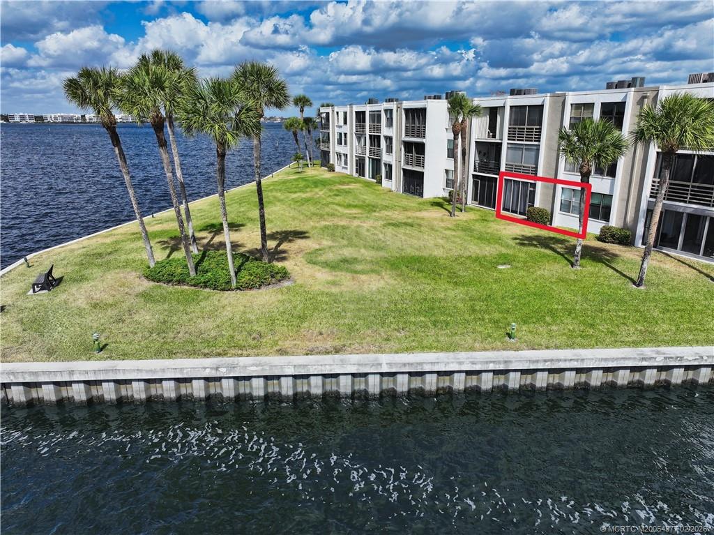 1950 Southwest Palm City Road, Unit 13102 Stuart, FL 34994 - Photo 4 of 40 a view of swimming pool with a yard