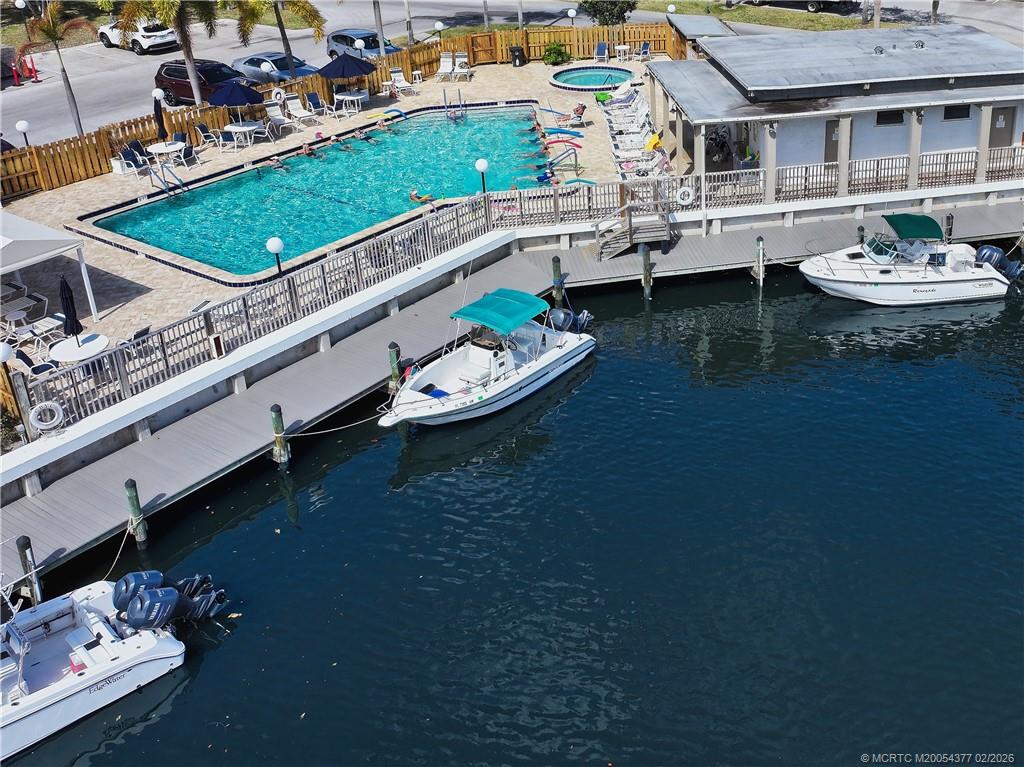 1950 Southwest Palm City Road, Unit 13102 Stuart, FL 34994 - Photo 9 of 40 a aerial view of a house with swimming pool and a fountain