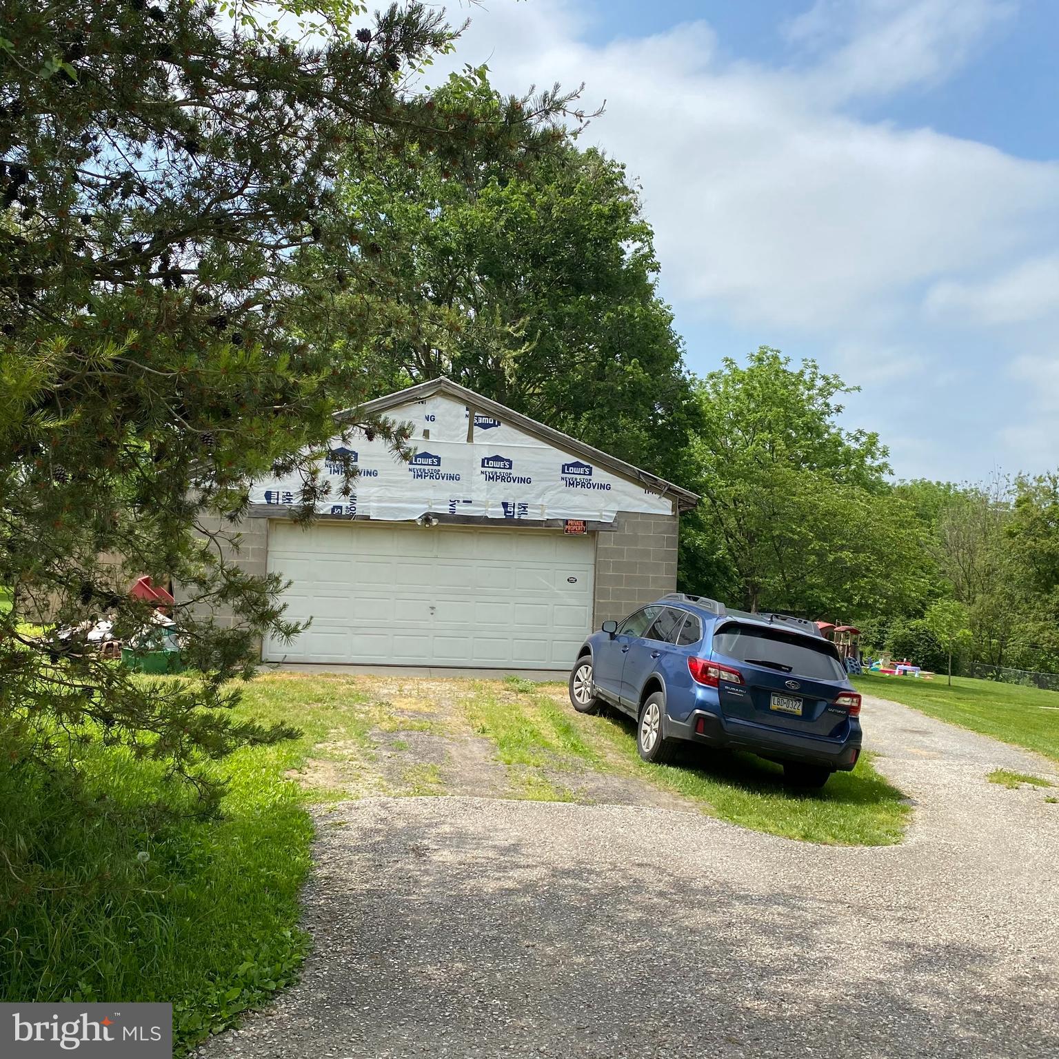 61 Baltimore Street Spring Grove, PA 17362 - Photo 2 of 51 a front view of a house with a garden and parking space