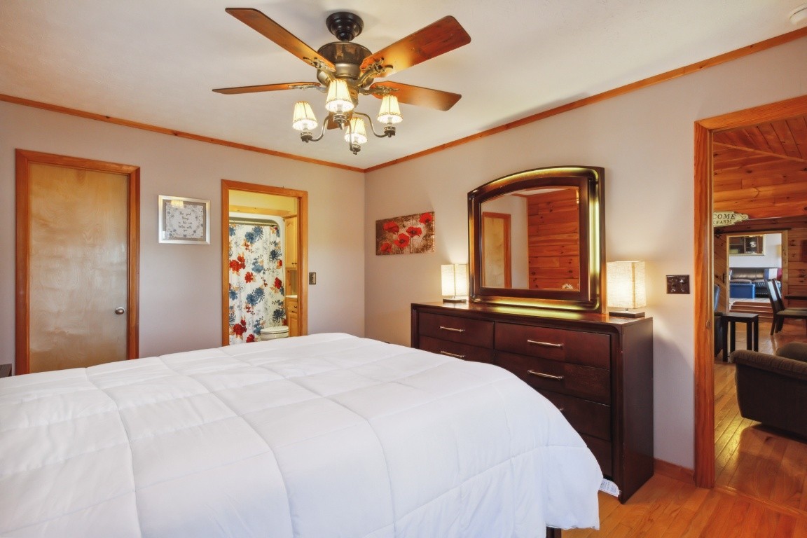 2000 Blue Well Road Lebanon, TN 37090 - Photo 26 of 39 a bedroom with a large bed and a chandelier