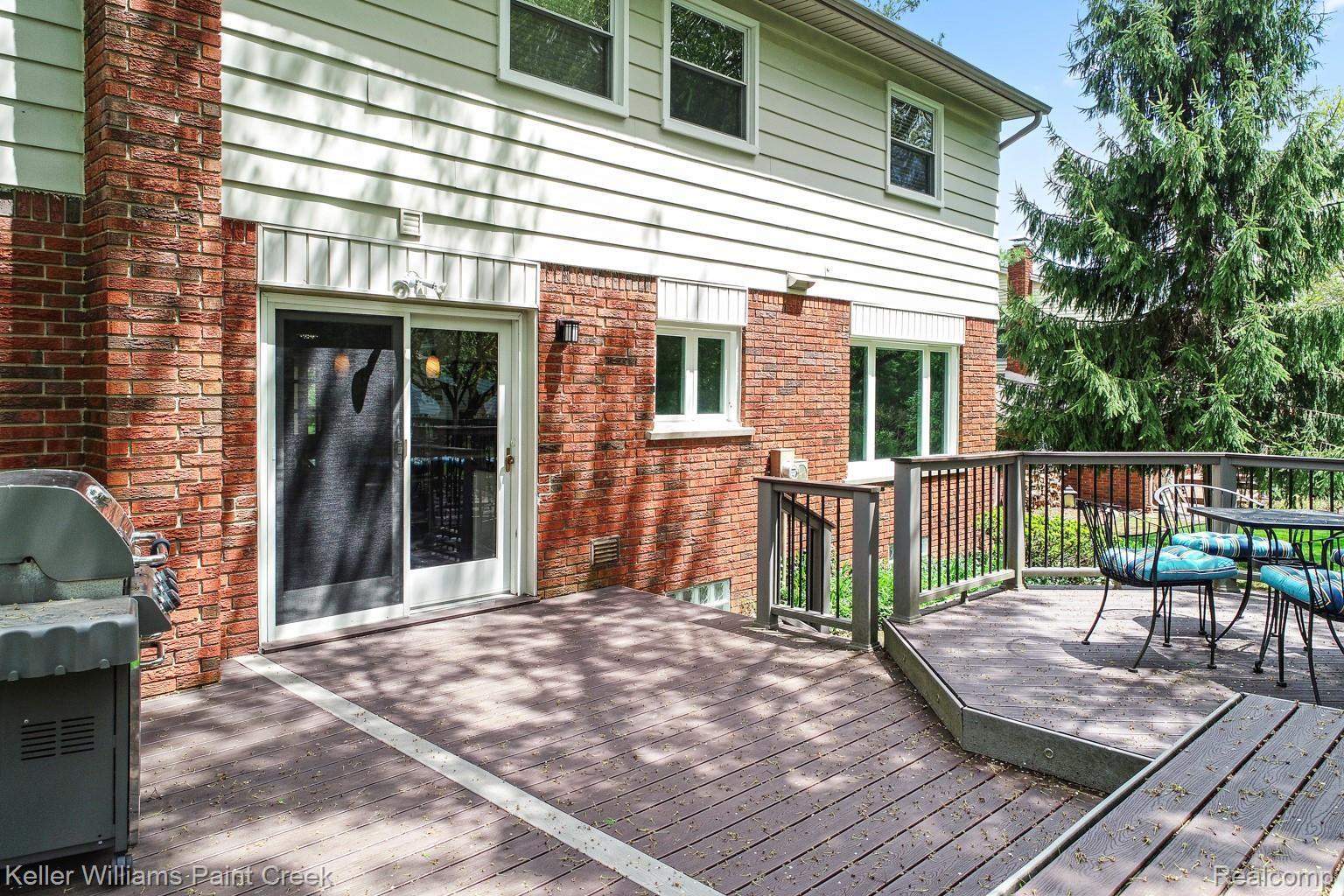 1491 Biggers Drive Rochester, MI 48309 - Photo 10 of 42 The Trex deck is the perfect cherry on top of a gorgeous yard