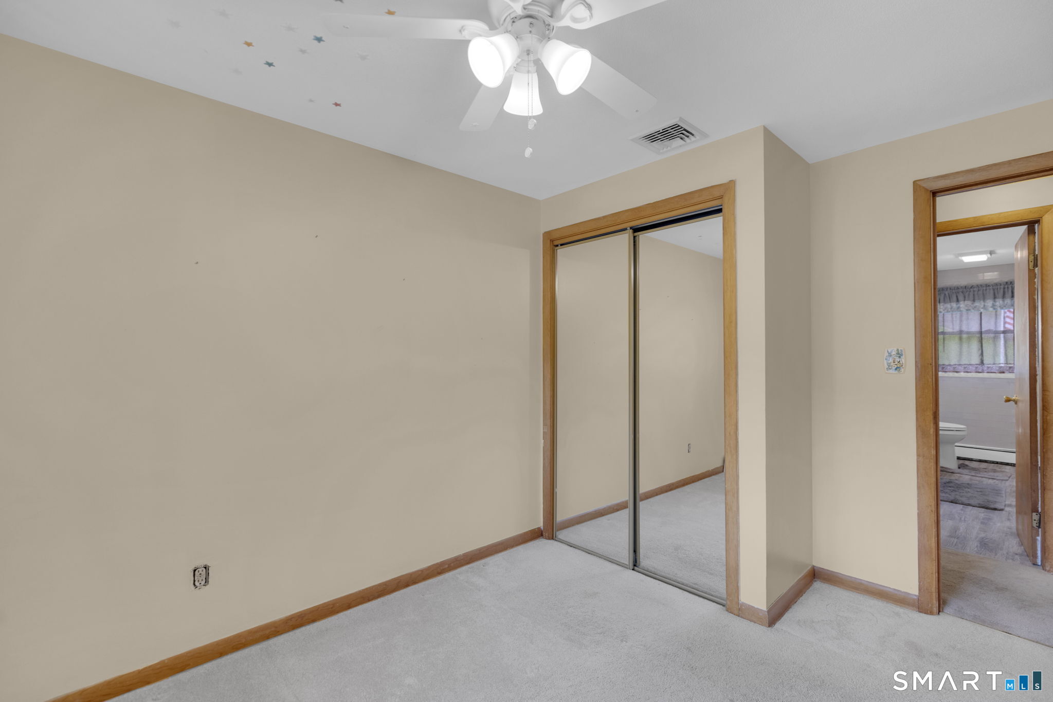 102 Wayne Lane Meriden, CT 06450 - Photo 14 of 36 an empty room with a ceiling fan and carpet