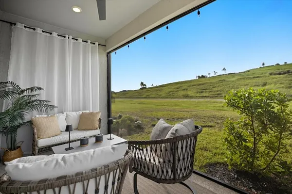 a view of a chairs and table in patio