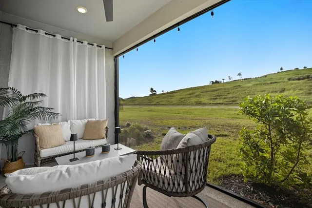 a view of a chairs and table in patio