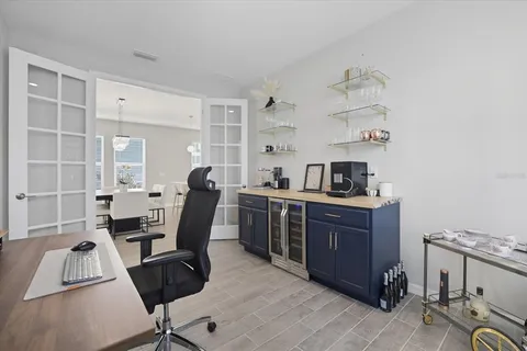 a work room with furniture and wooden floor