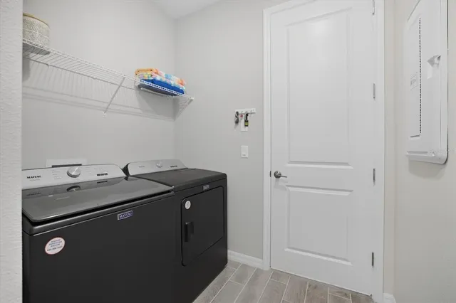 a utility room with dryer and washer
