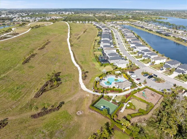 an aerial view of residential houses with outdoor space