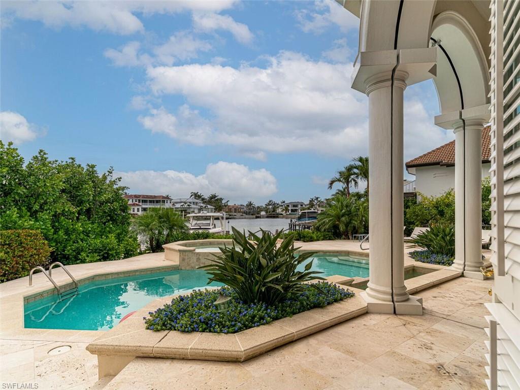 330 Devils Bight Naples, FL 34103 - Photo 11 of 47 a view of a garden