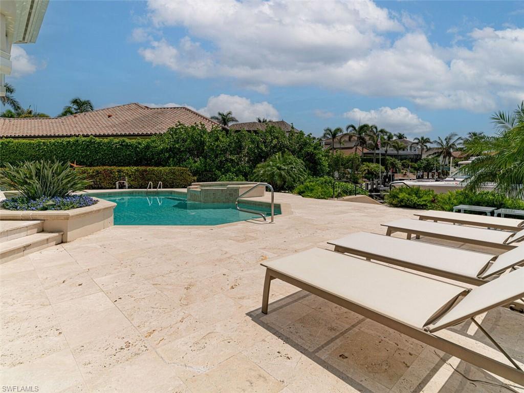 330 Devils Bight Naples, FL 34103 - Photo 14 of 47 a view of a terrace with a garden