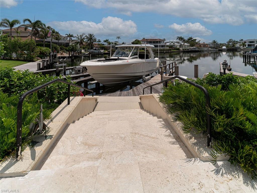 330 Devils Bight Naples, FL 34103 - Photo 15 of 47 a view of a terrace with sitting area