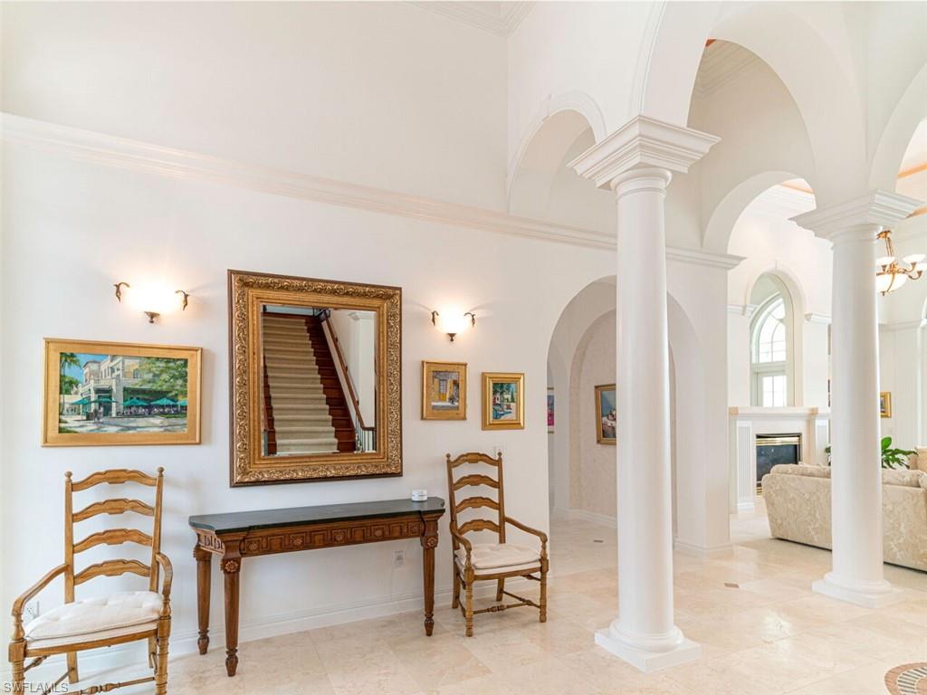 330 Devils Bight Naples, FL 34103 - Photo 22 of 47 a view of a livingroom with furniture and windows