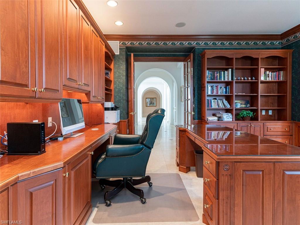 330 Devils Bight Naples, FL 34103 - Photo 32 of 47 a living room with furniture a rug and a window