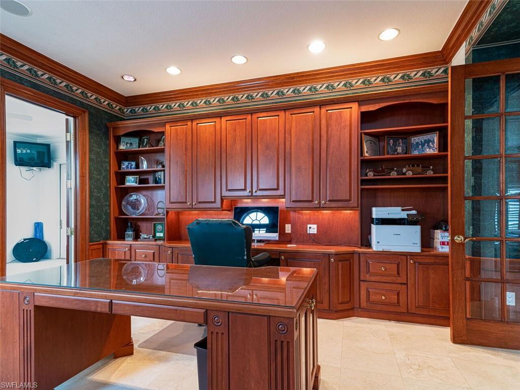 330 Devils Bight Naples, FL 34103 - Photo 33 of 47 a kitchen with stainless steel appliances granite countertop a refrigerator and a sink