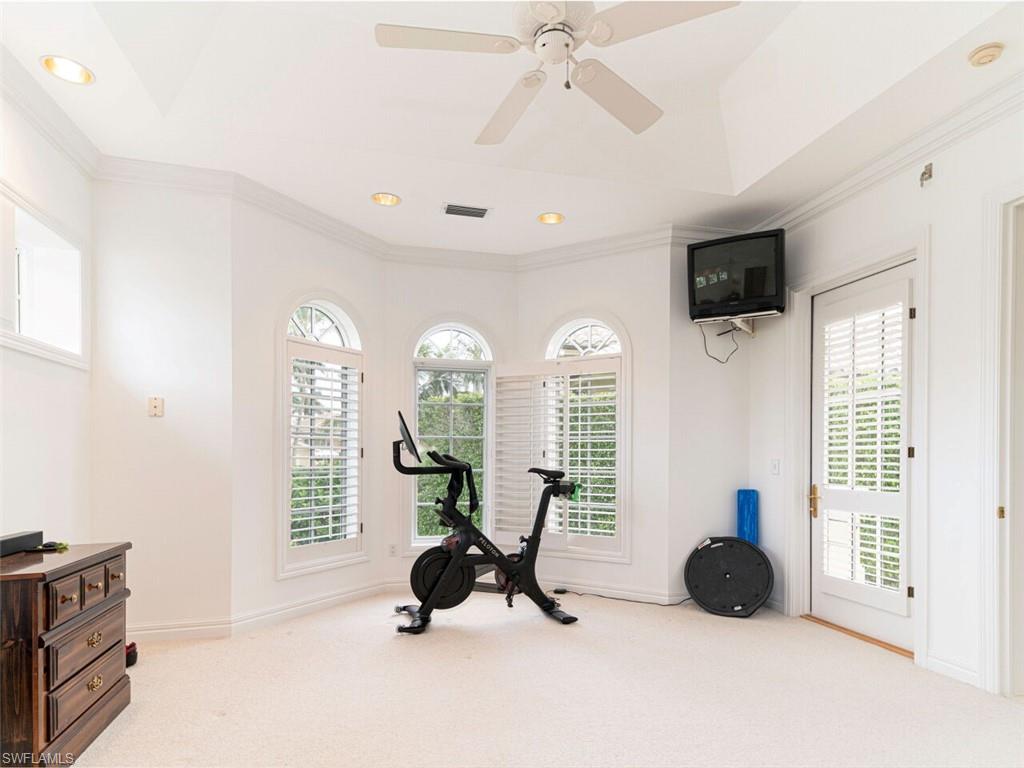 330 Devils Bight Naples, FL 34103 - Photo 34 of 47 a view of a livingroom with workspace and a window