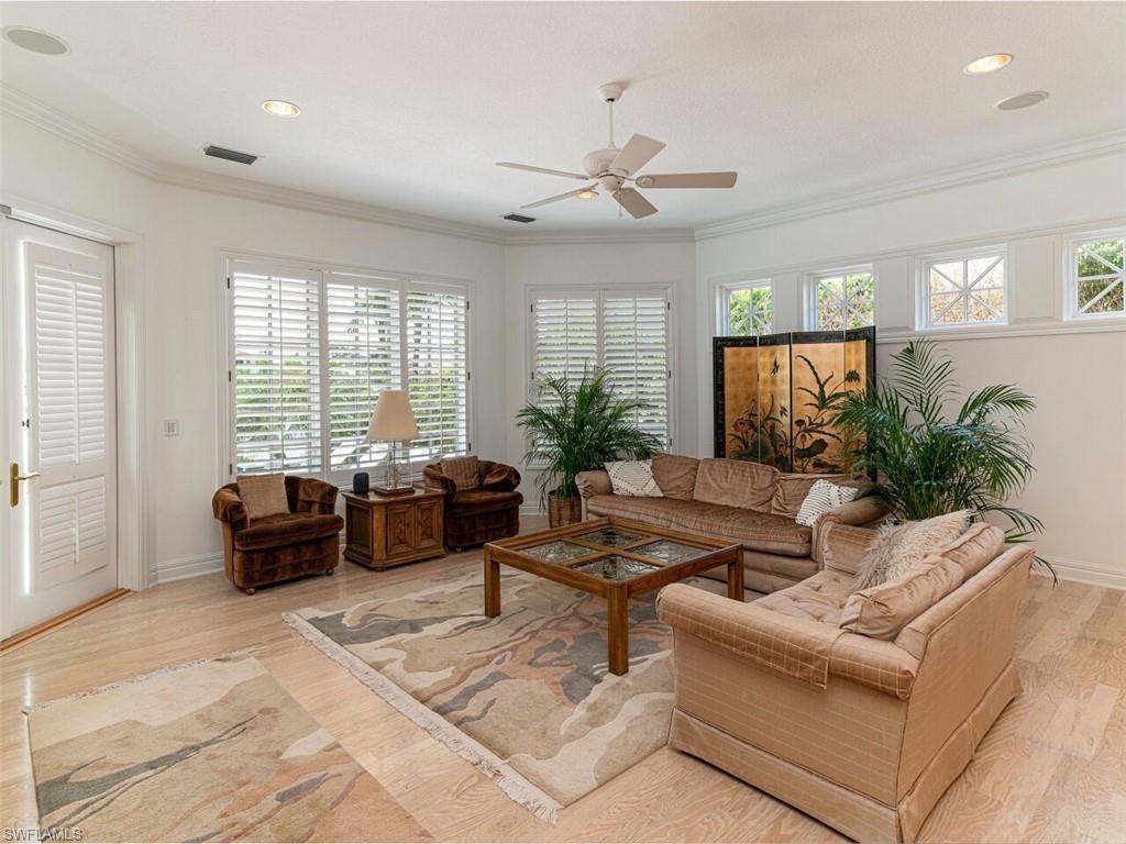 330 Devils Bight Naples, FL 34103 - Photo 36 of 47 a living room with furniture and a large window