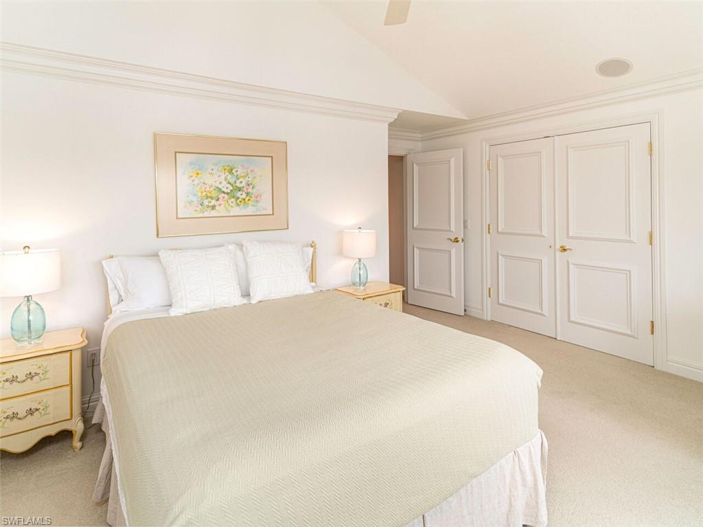 330 Devils Bight Naples, FL 34103 - Photo 42 of 47 a bedroom with a bed and a window