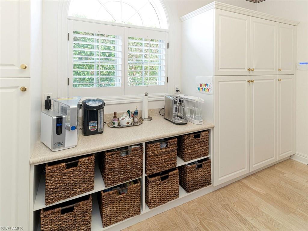 330 Devils Bight Naples, FL 34103 - Photo 46 of 47 a kitchen with stainless steel appliances cabinets and window