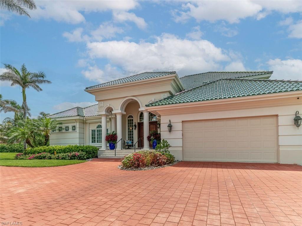 330 Devils Bight Naples, FL 34103 - Photo 8 of 47 a view of a house with a yard