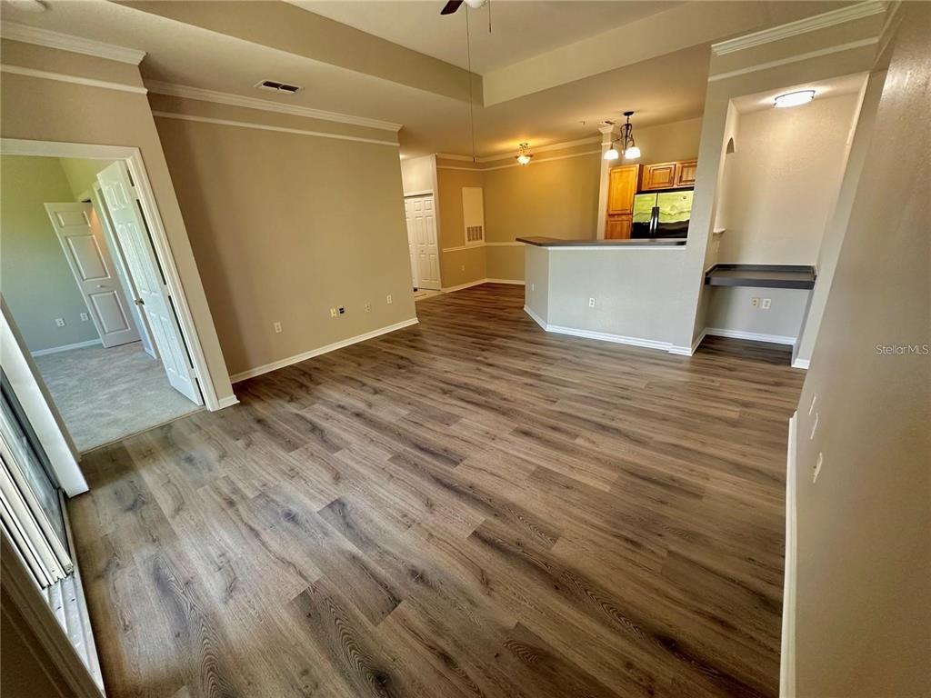3280 Soho Street, Unit 307 Orlando, FL 32835 - Photo 6 of 34 a view of a room with wooden floor