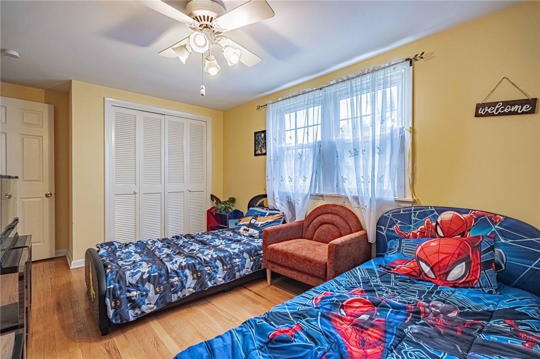 285 Bridle Path Road Bethlehem, PA 18017 - Photo 35 of 54 a bedroom with two beds and a chandelier