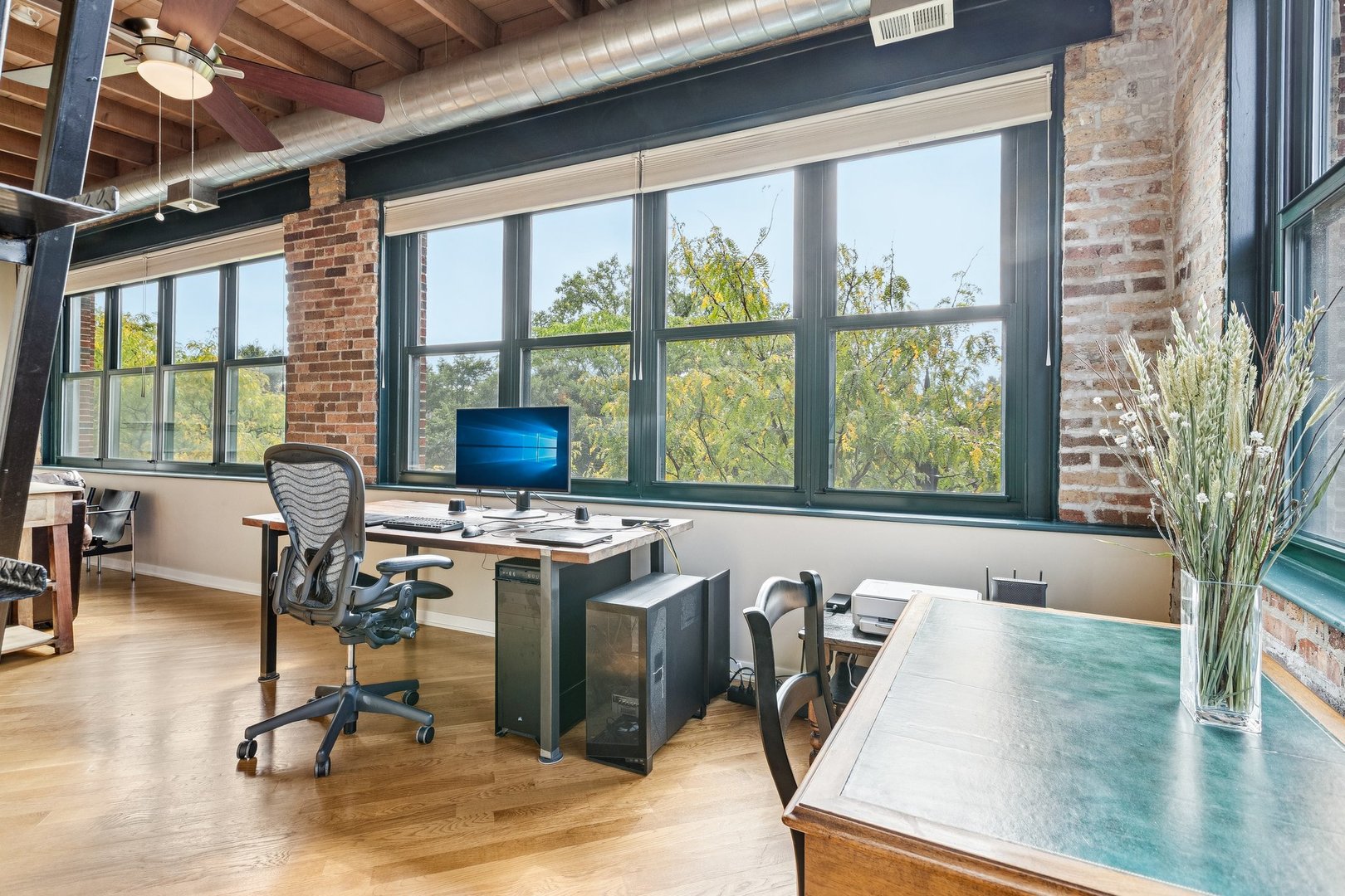 3201 North Ravenswood Avenue, Unit 301 Chicago, IL 60657 - Photo 20 of 38 a view of a workspace with furniture and a window