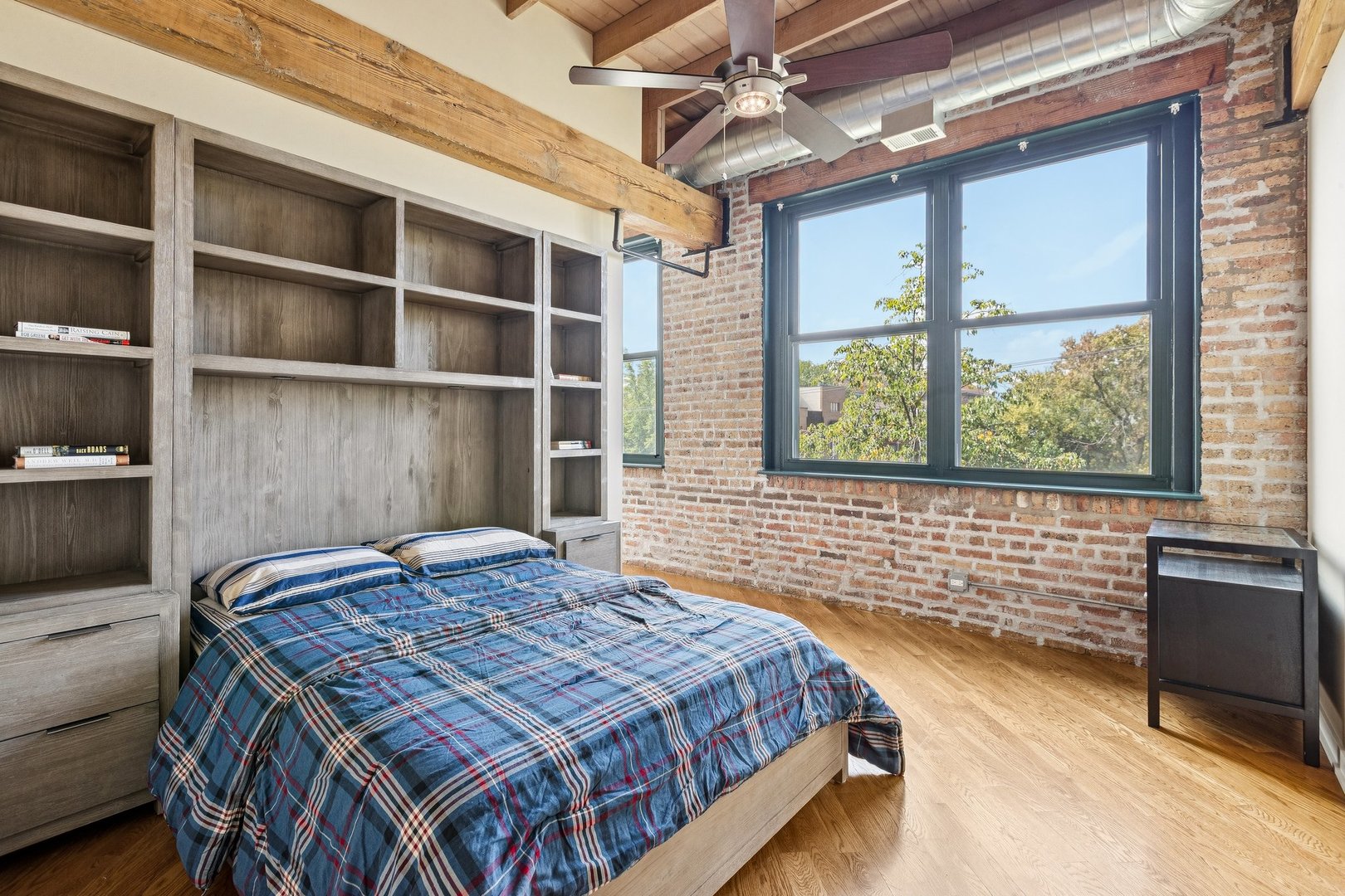 3201 North Ravenswood Avenue, Unit 301 Chicago, IL 60657 - Photo 26 of 38 a bedroom with a bed and a window