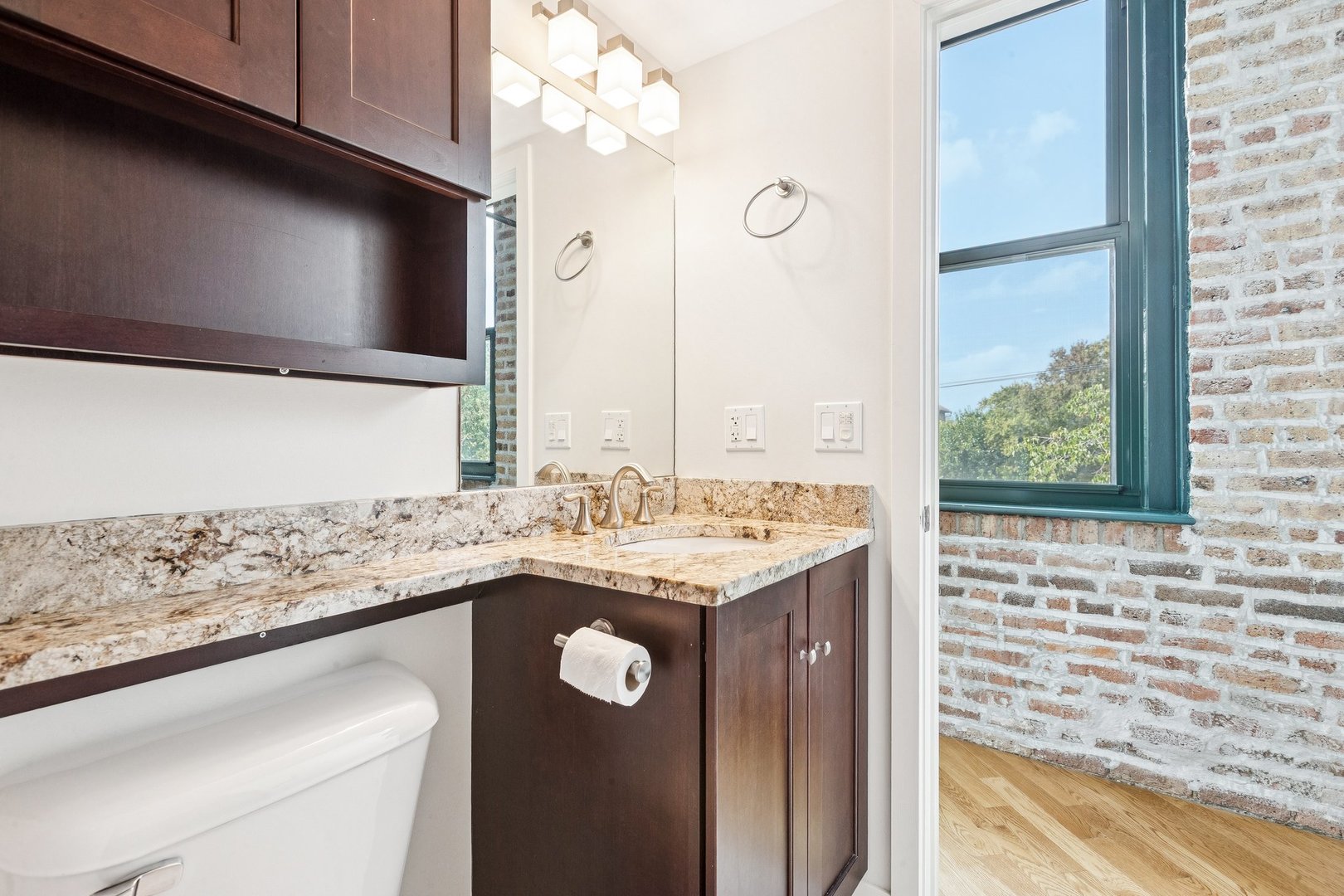 3201 North Ravenswood Avenue, Unit 301 Chicago, IL 60657 - Photo 30 of 38 a kitchen with granite countertop a sink and a stove