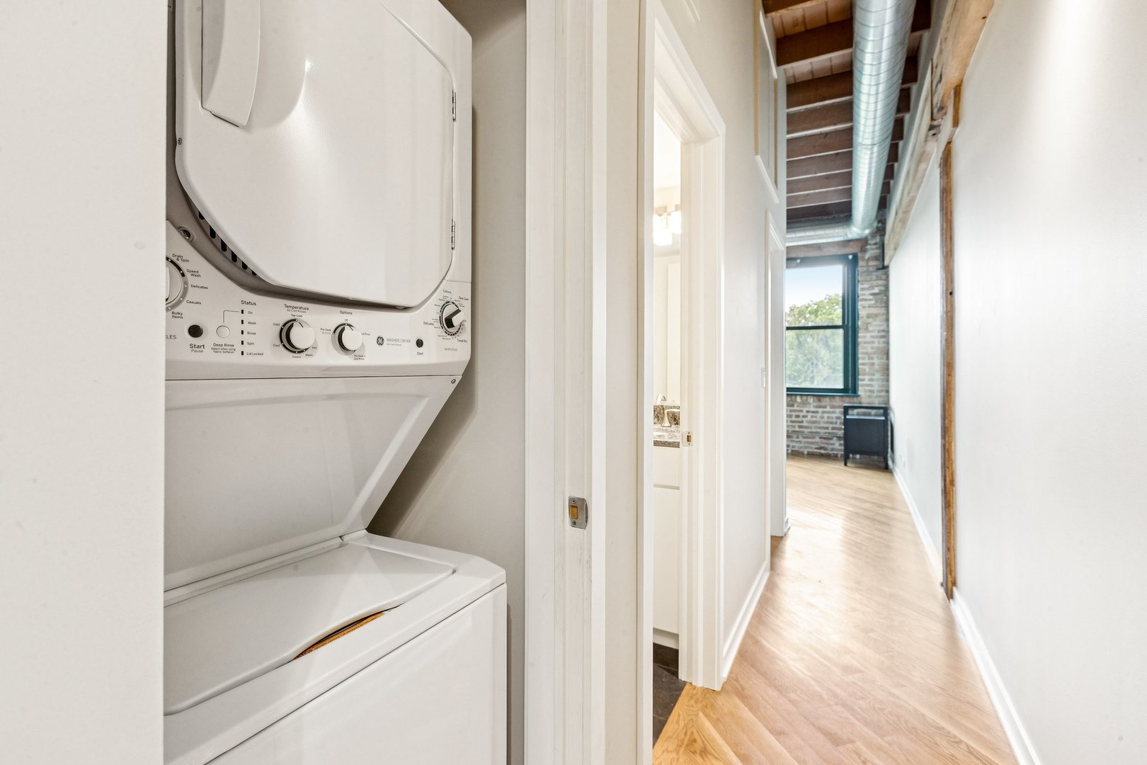 3201 North Ravenswood Avenue, Unit 301 Chicago, IL 60657 - Photo 31 of 38 a view of a hallway with wooden floor